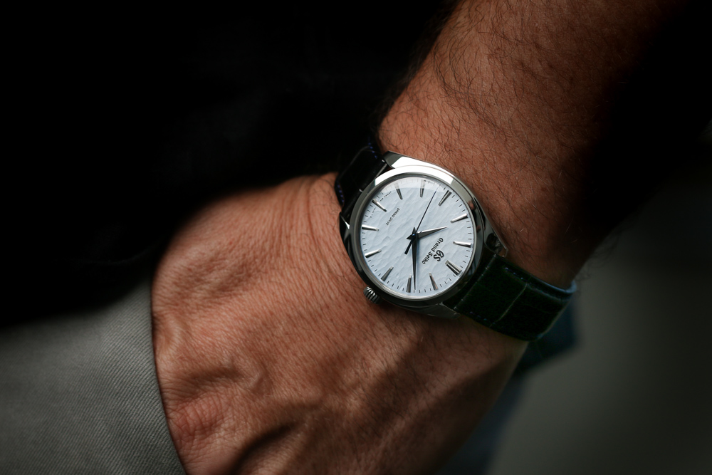 Grand Seiko SBGY007 Omiwatari blue dial men's timepiece on the wrist