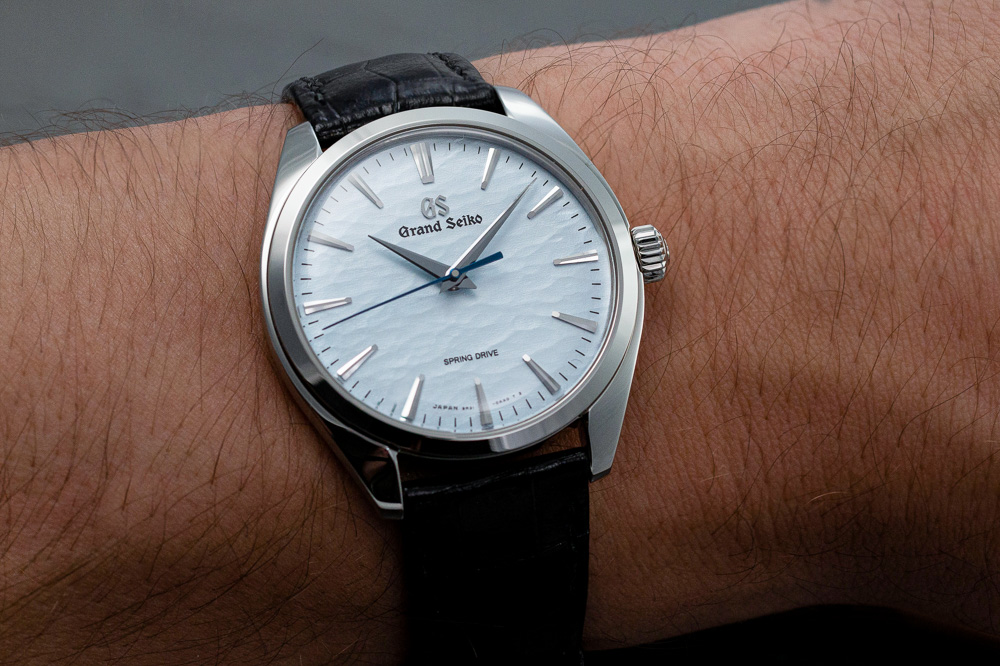 Grand Seiko SBGY007 blue dial men's watch on wrost