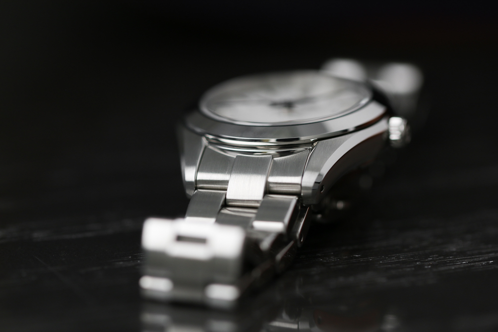 Grand Seiko STGF359 white dial wristwatch on a tabletop